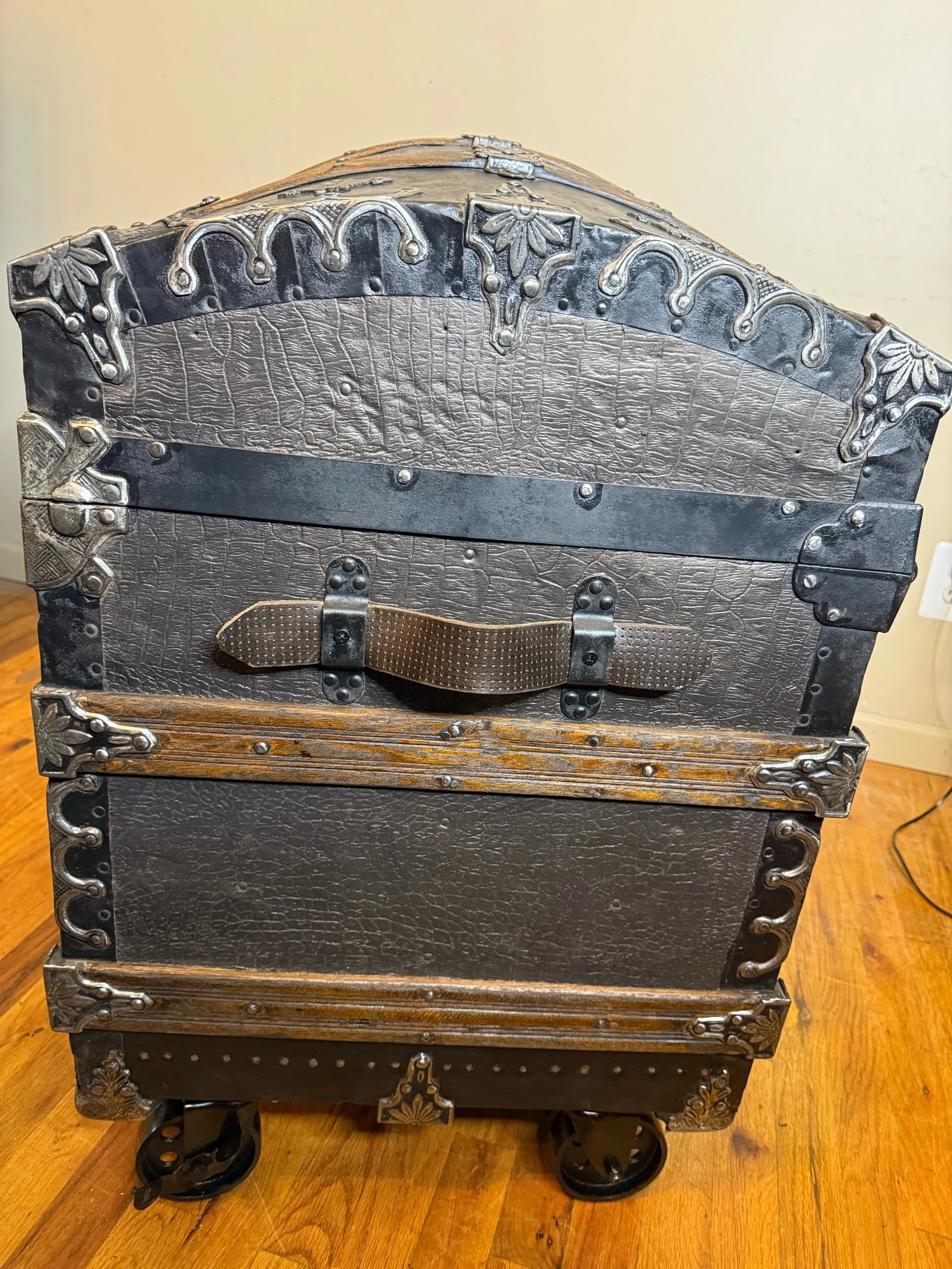 Side view of large Victorian humpback steamer trunk