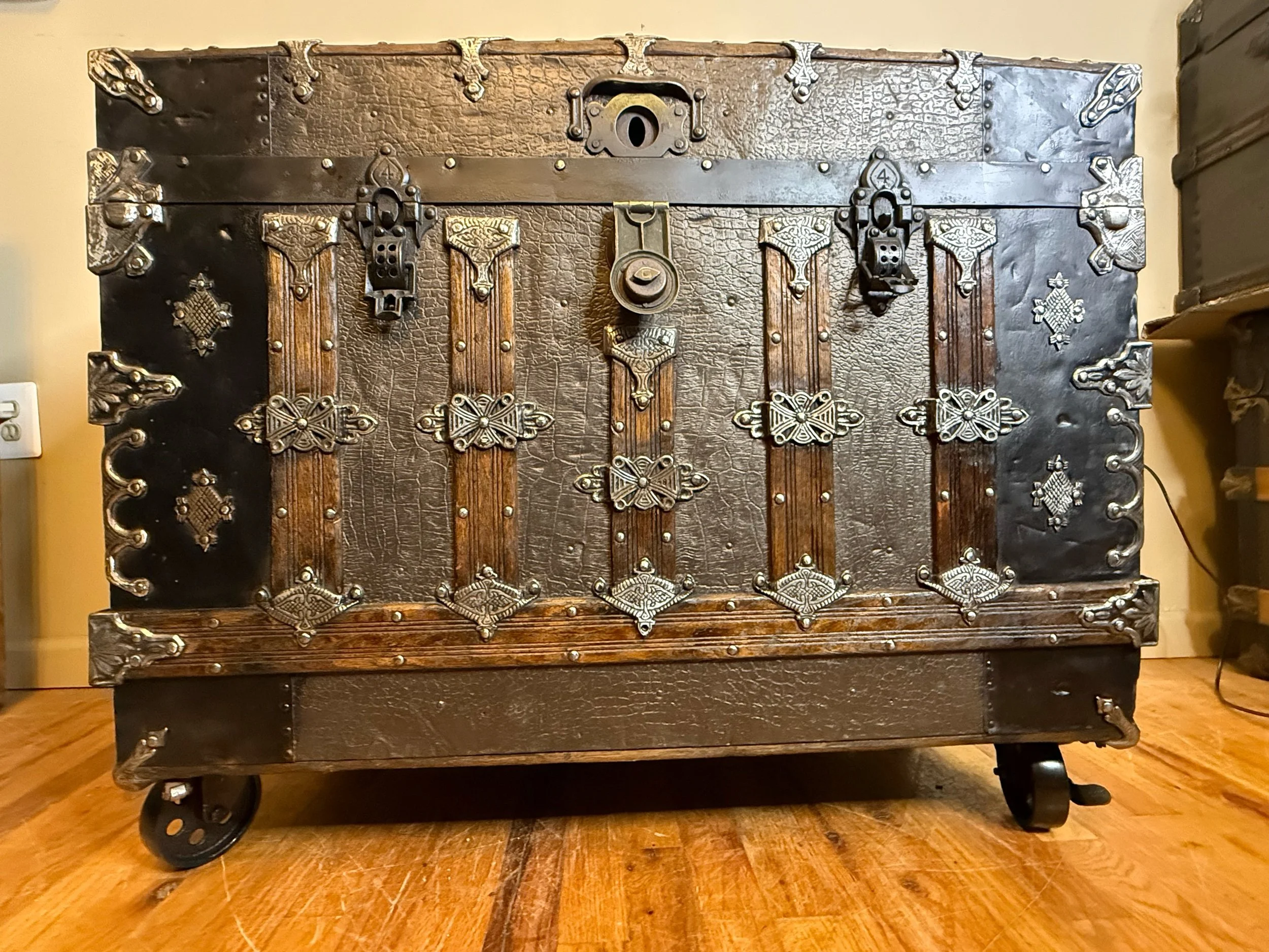 Walnut stained wood slats on Victorian steamer trunk