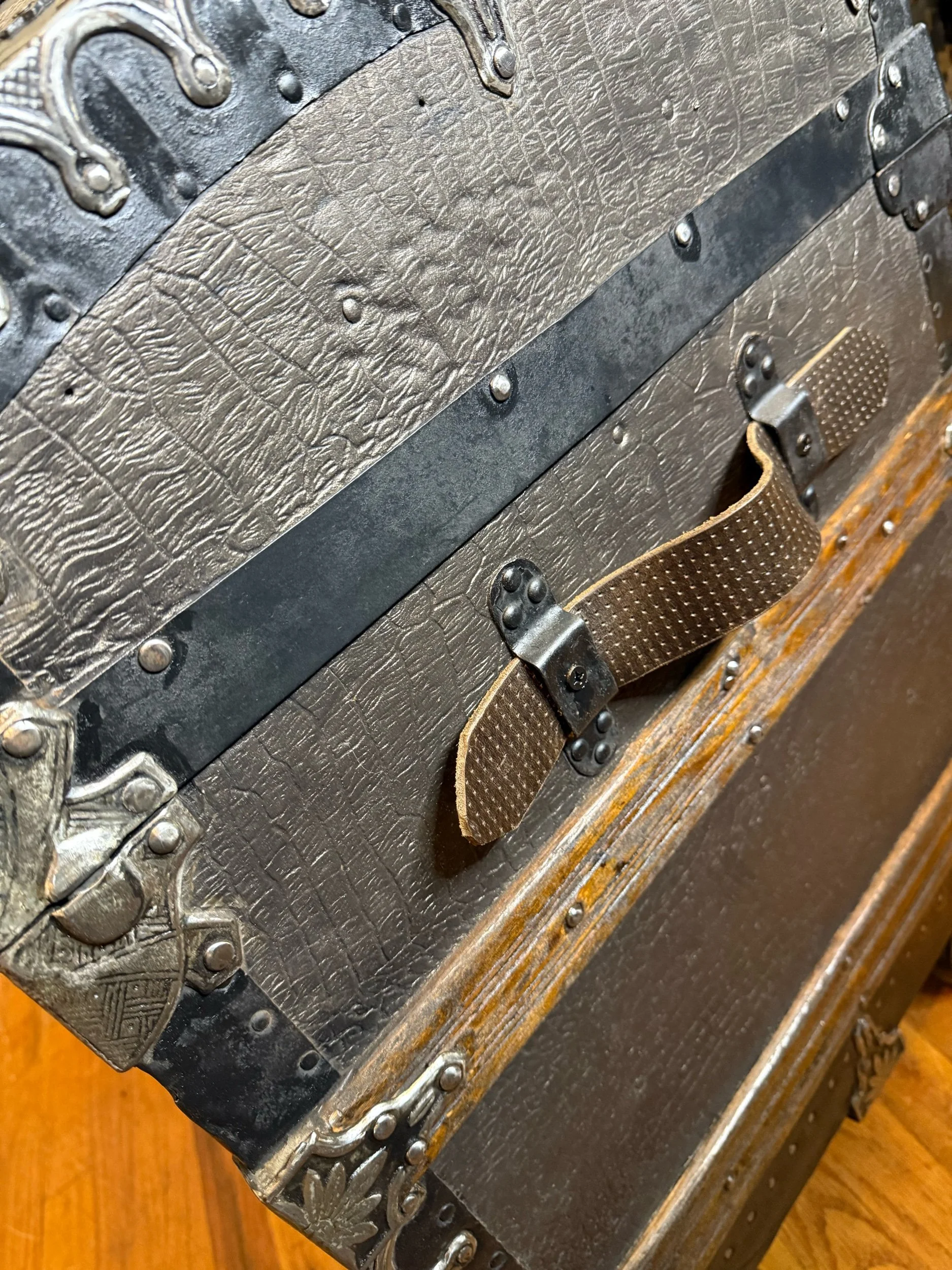 Custom aged brown leather handle on restored antique trunk