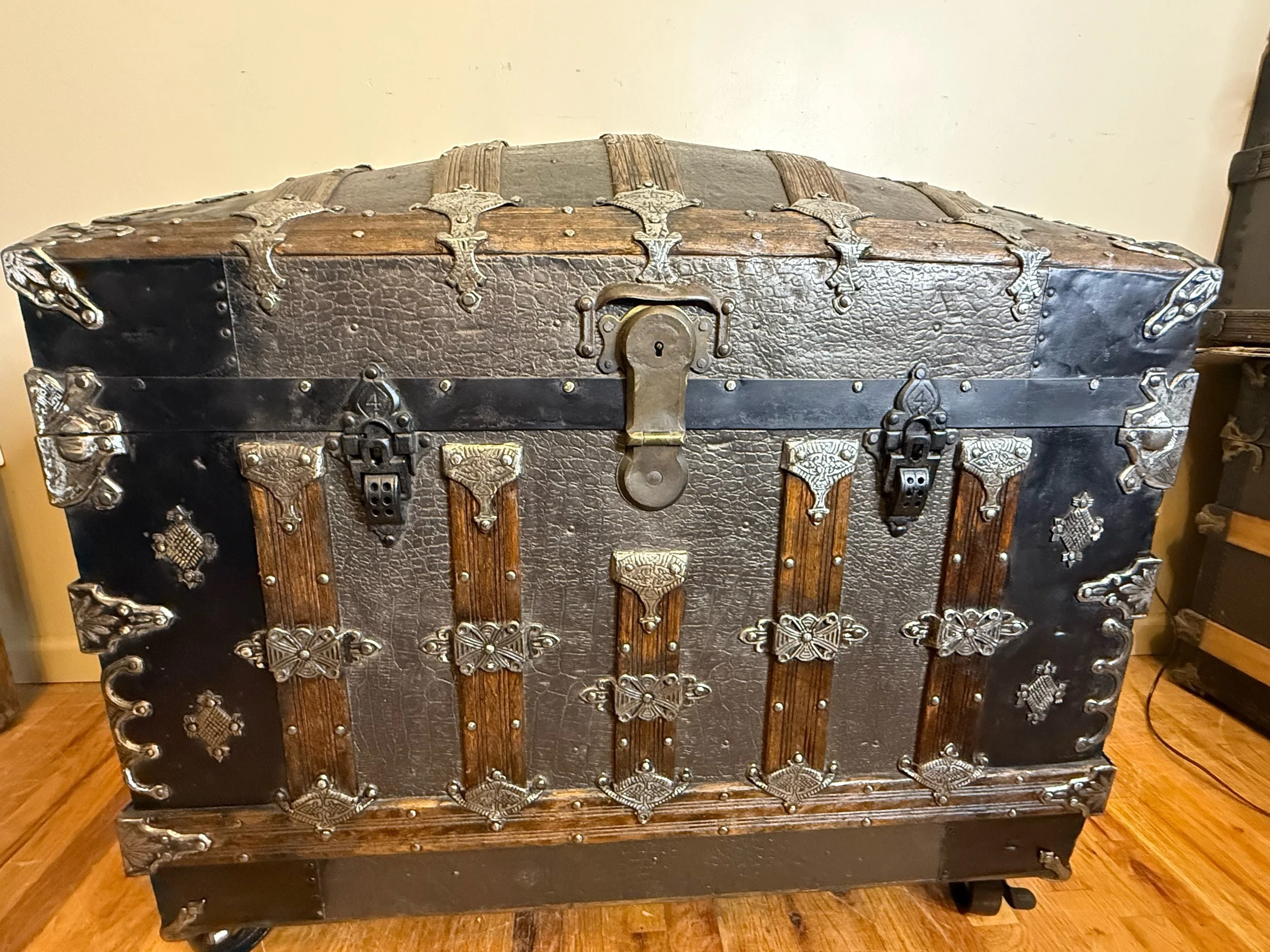 Tall dome top antique travel trunk from the late 1800s