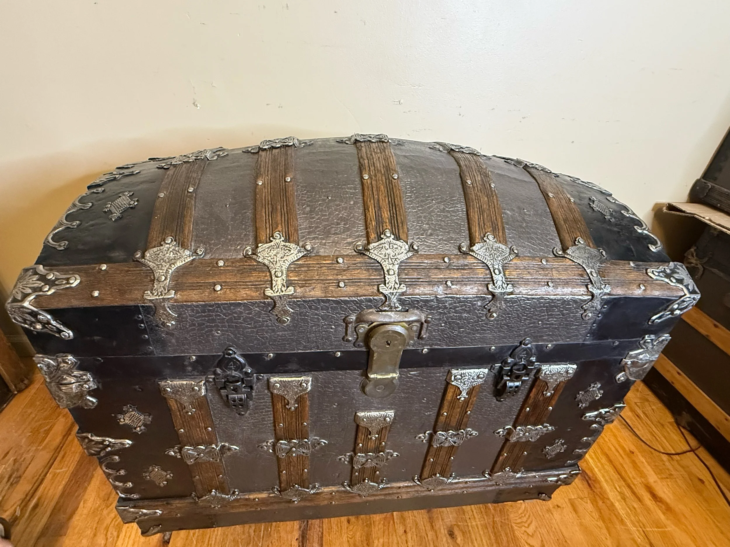 Large antique storage chest with walnut stained wood slats