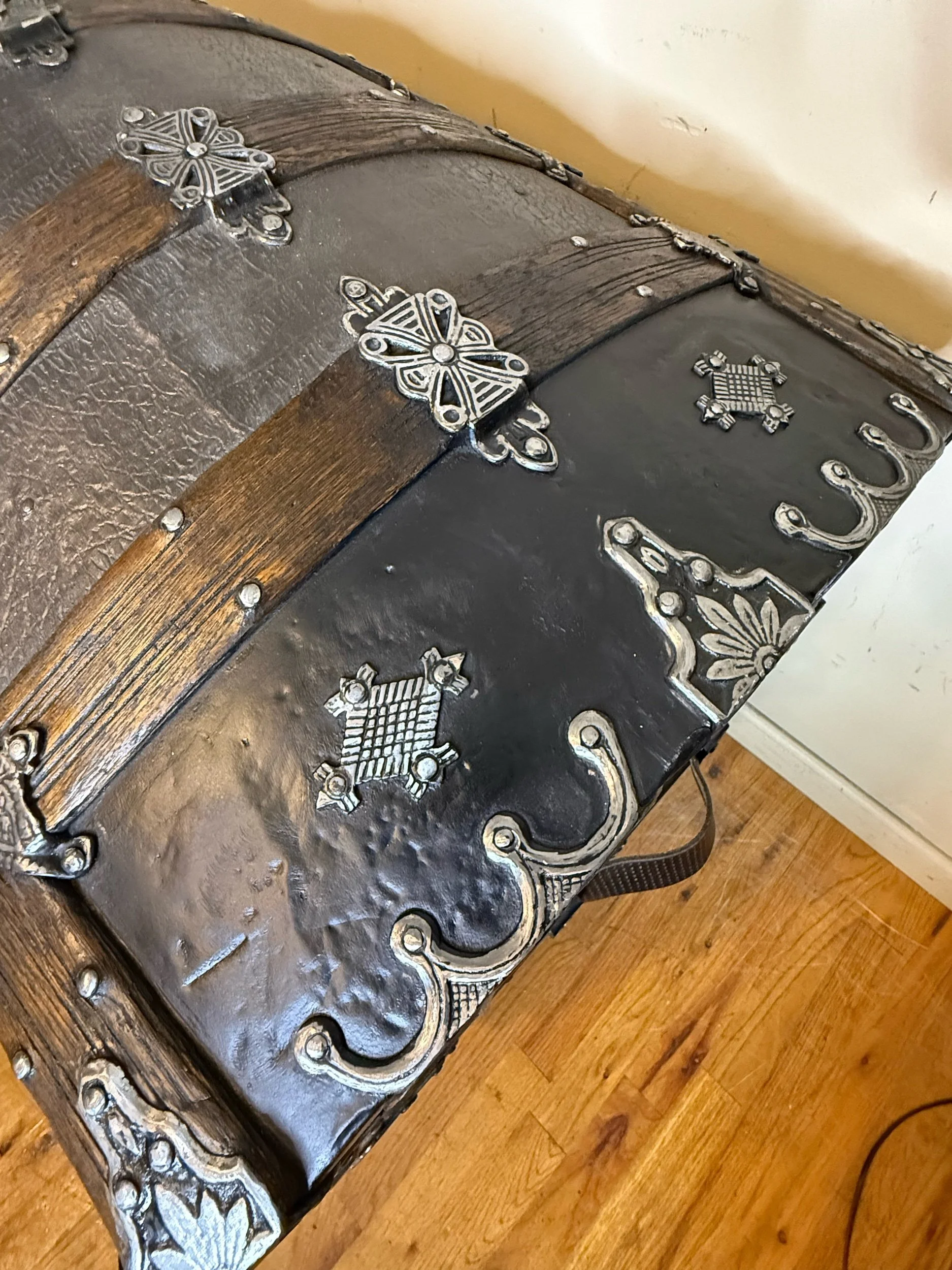 Antique travel chest with ornate hardware and walnut wood trim