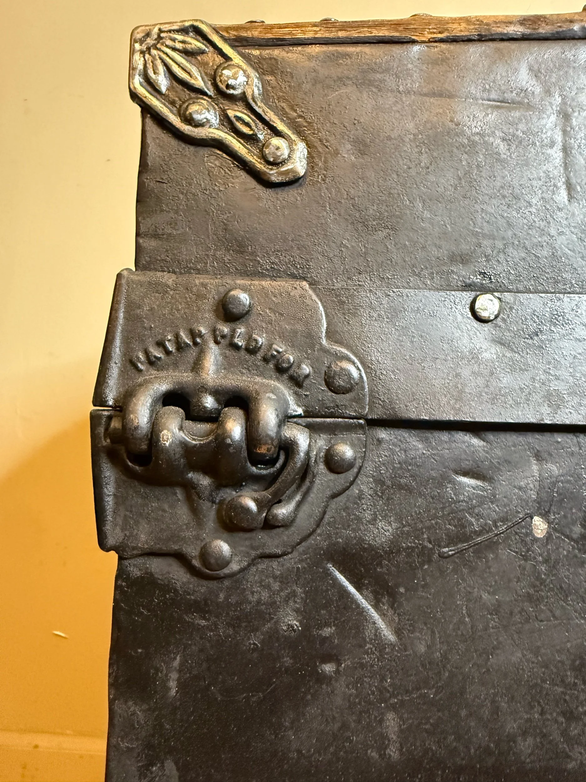 Ornate antique trunk hinge and Victorian hardware detail
