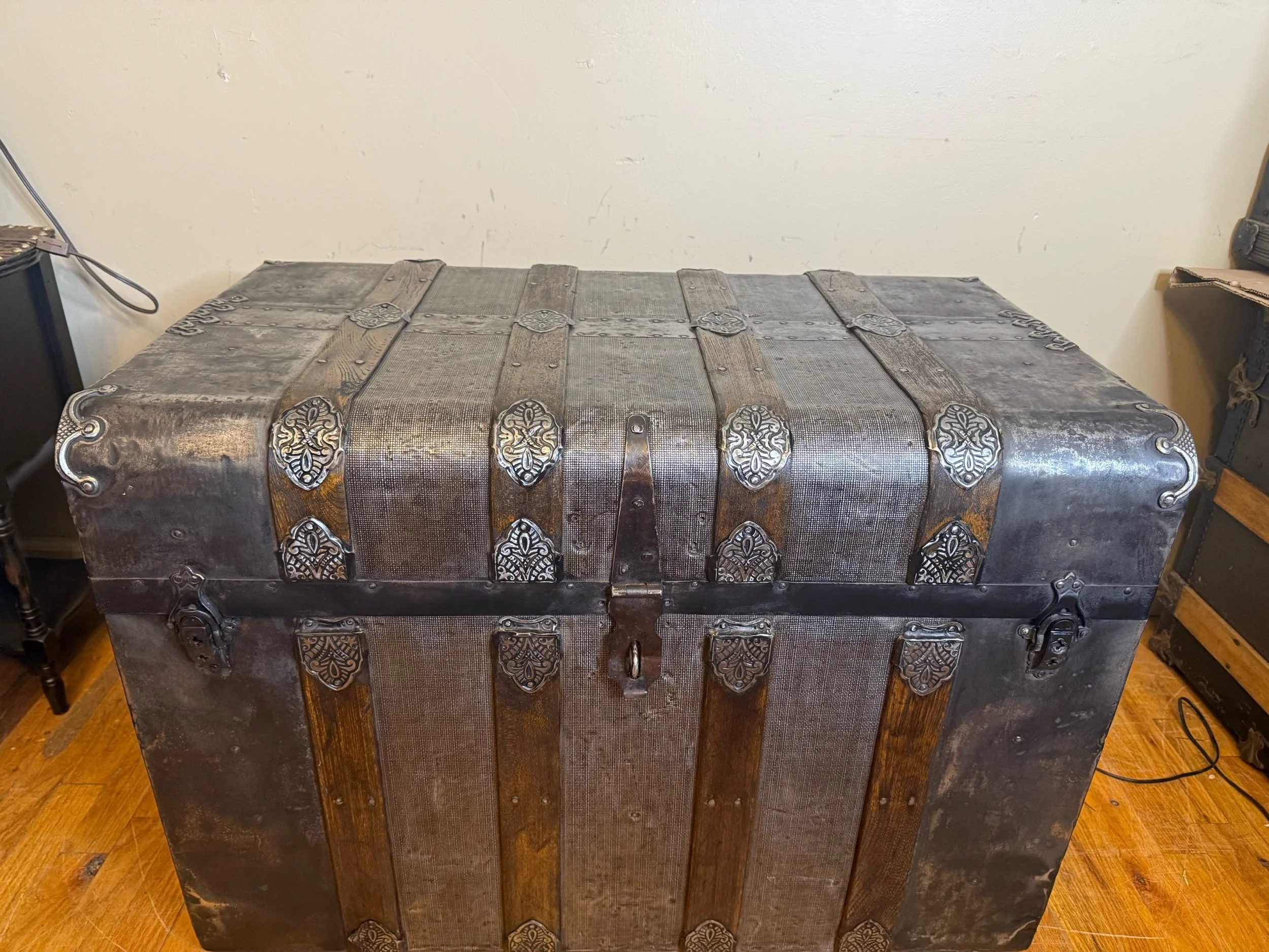 Victorian antique trunk with textured tin exterior