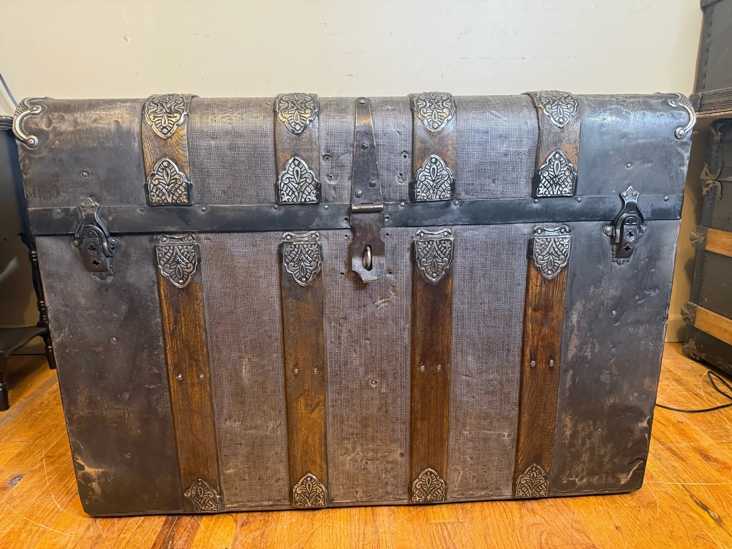Antique steamer trunk coffee table with crocodile textured tin