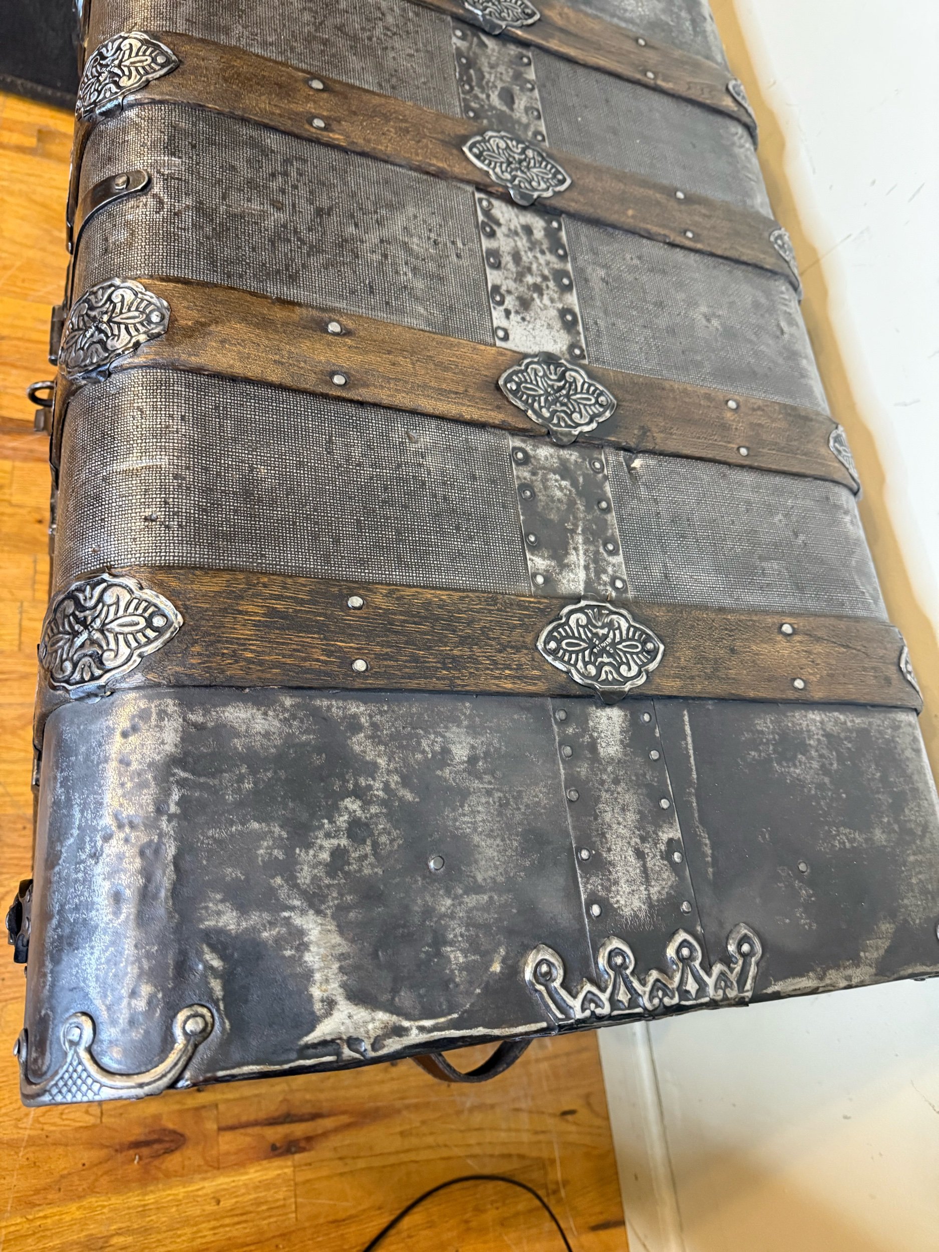 tin detail on antique steamer trunk