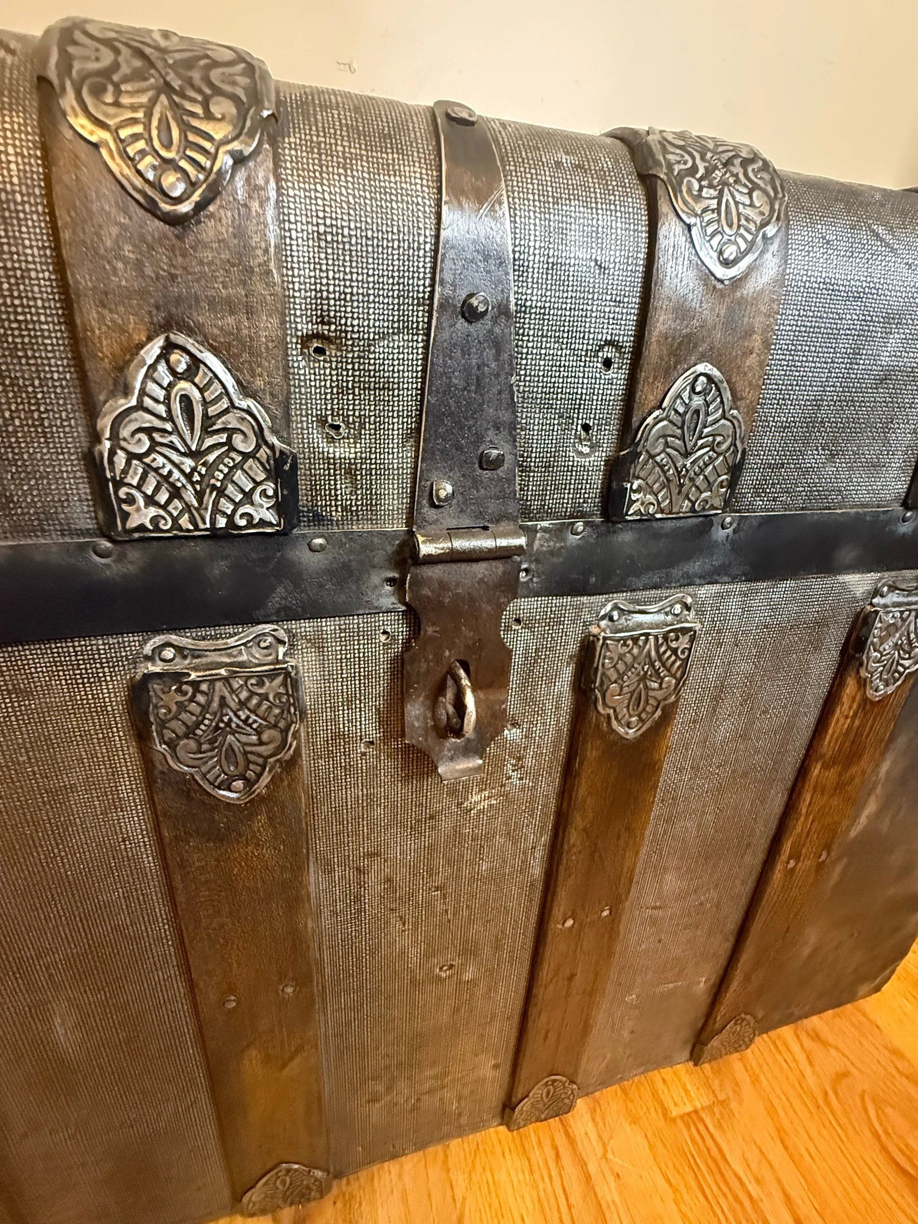 Close up of textured tin on Victorian antique trunk