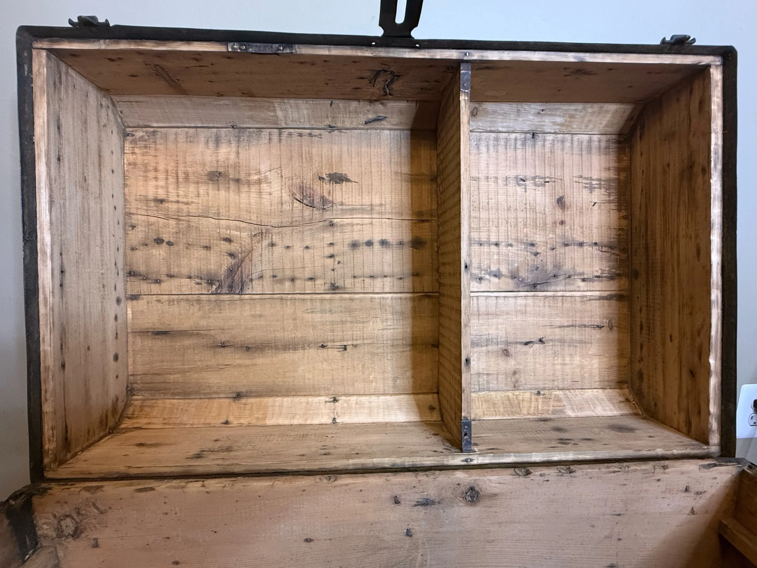 Sanded interior of Victorian antique travel trunk