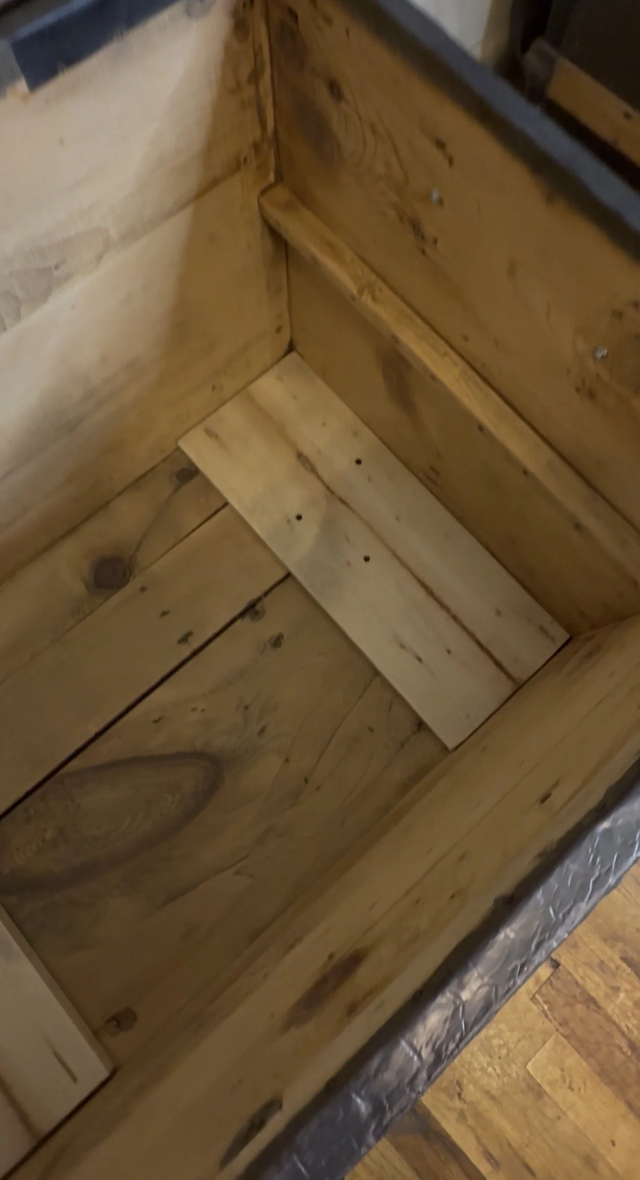 Natural wood interior inside antique dome top storage chest