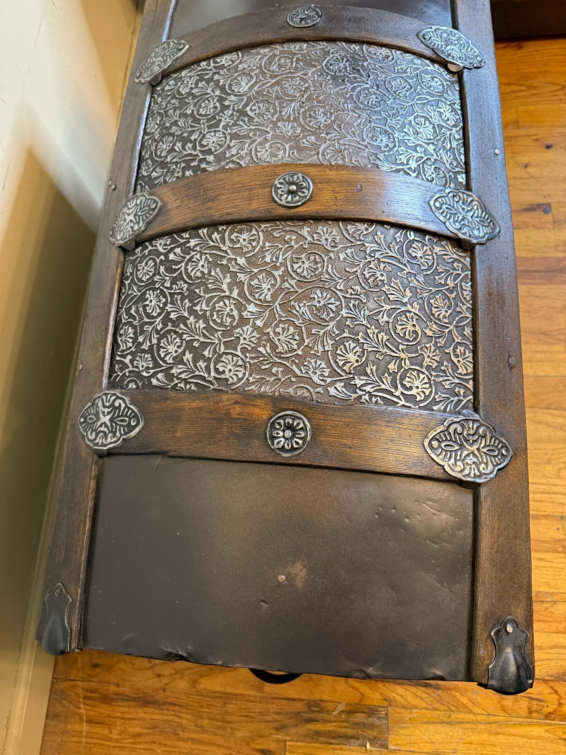 Buffed embossed tin detail on late 1800s antique trunk