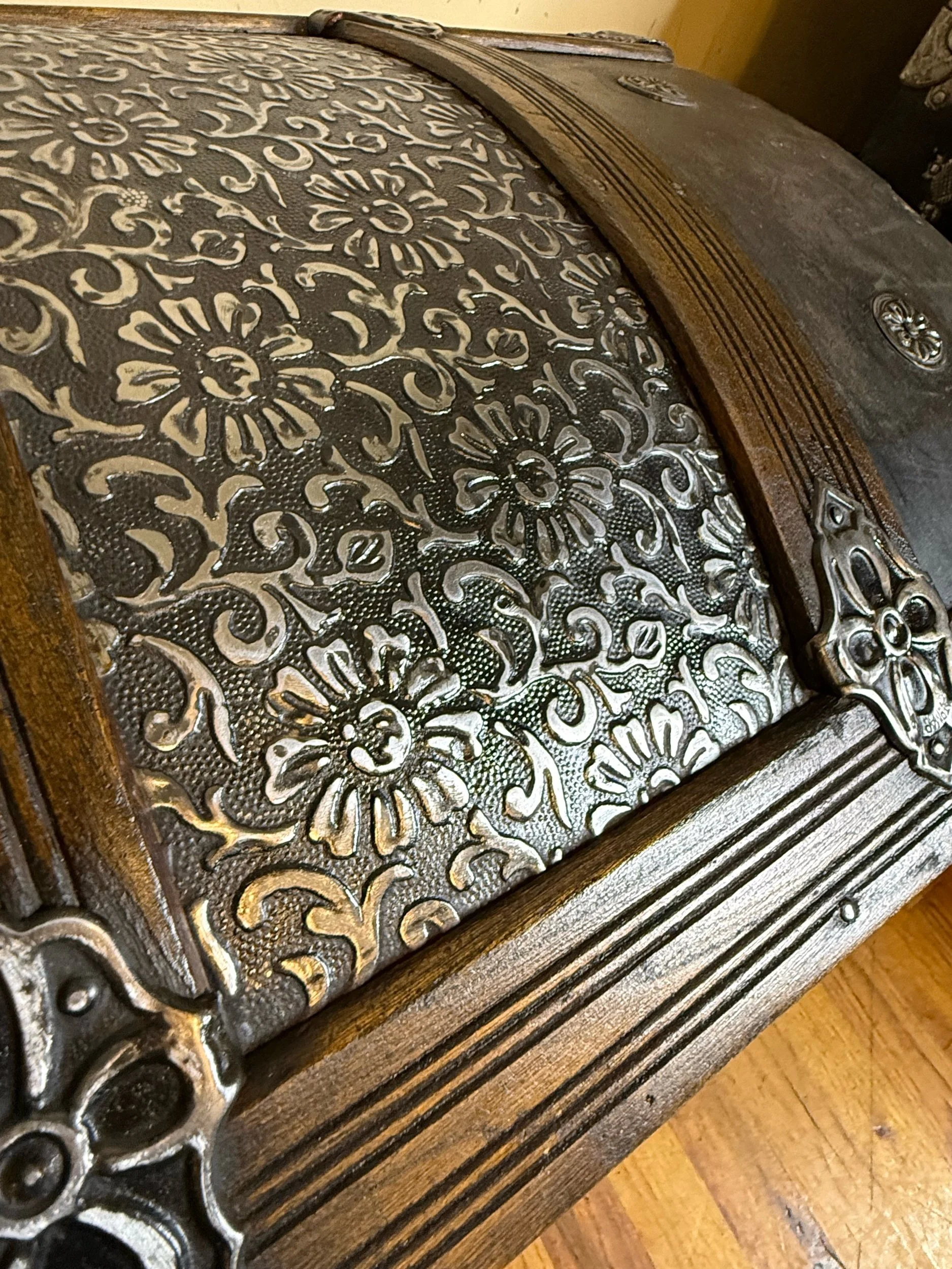 Floral embossed tin antique trunk with mirror bright details