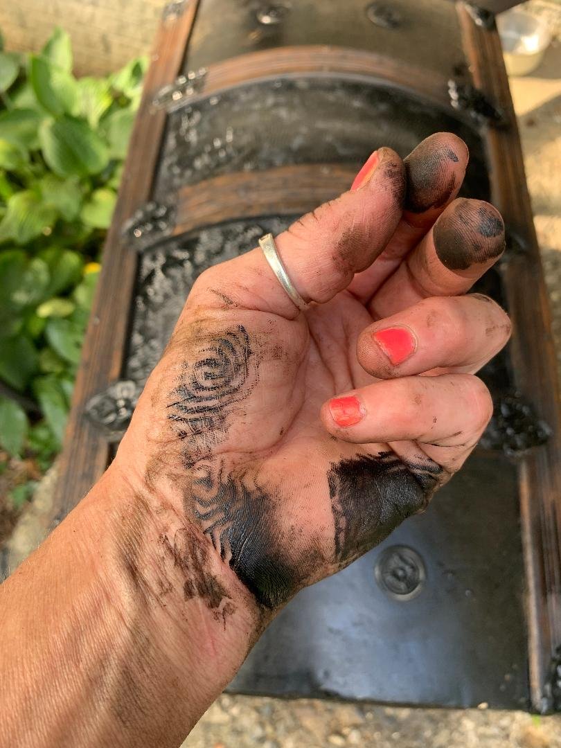 Angelina Nikon, a 4th generation restorer, working on a Victorian steamer trunk in her Novi, Michigan studio.