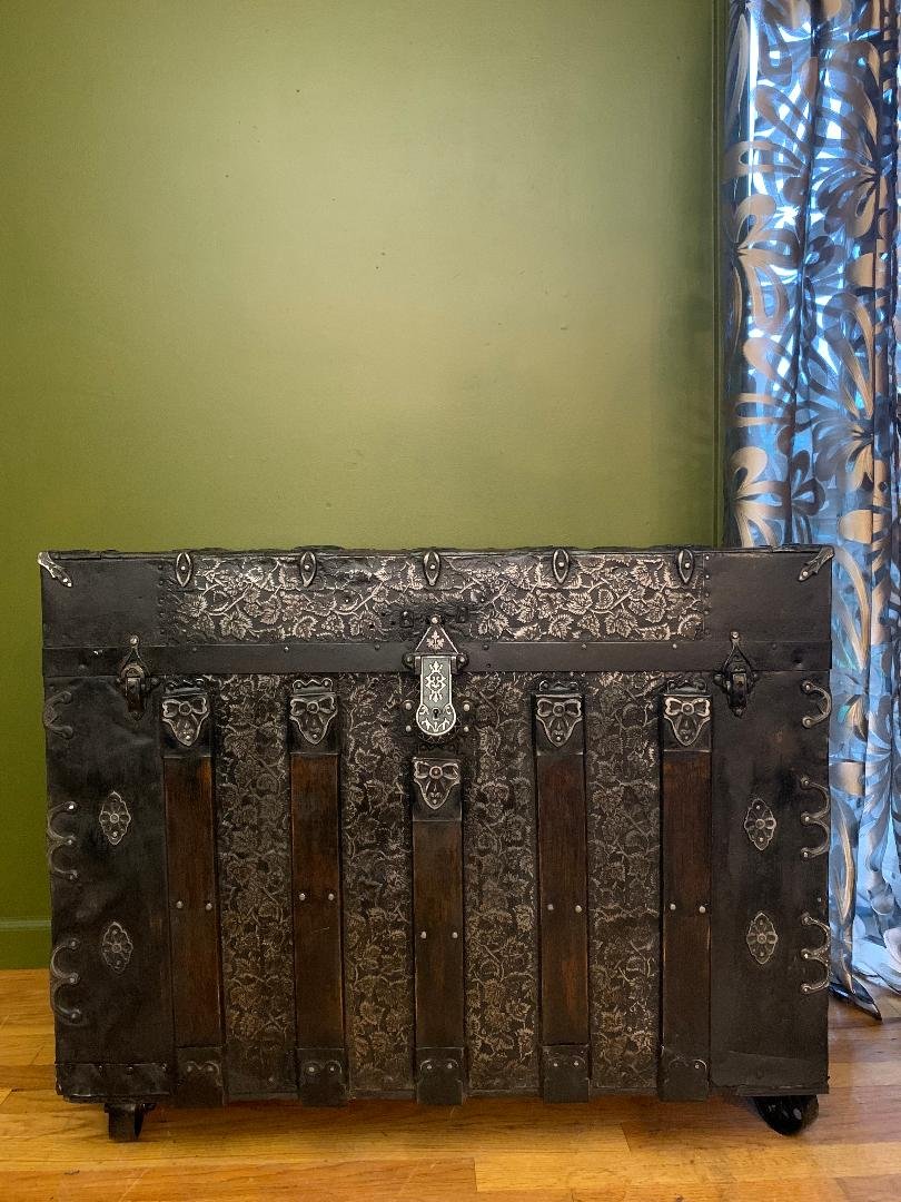 A masterfully restored antique trunk curated by Angelina Nikon, featuring a signature clean, sanded interior