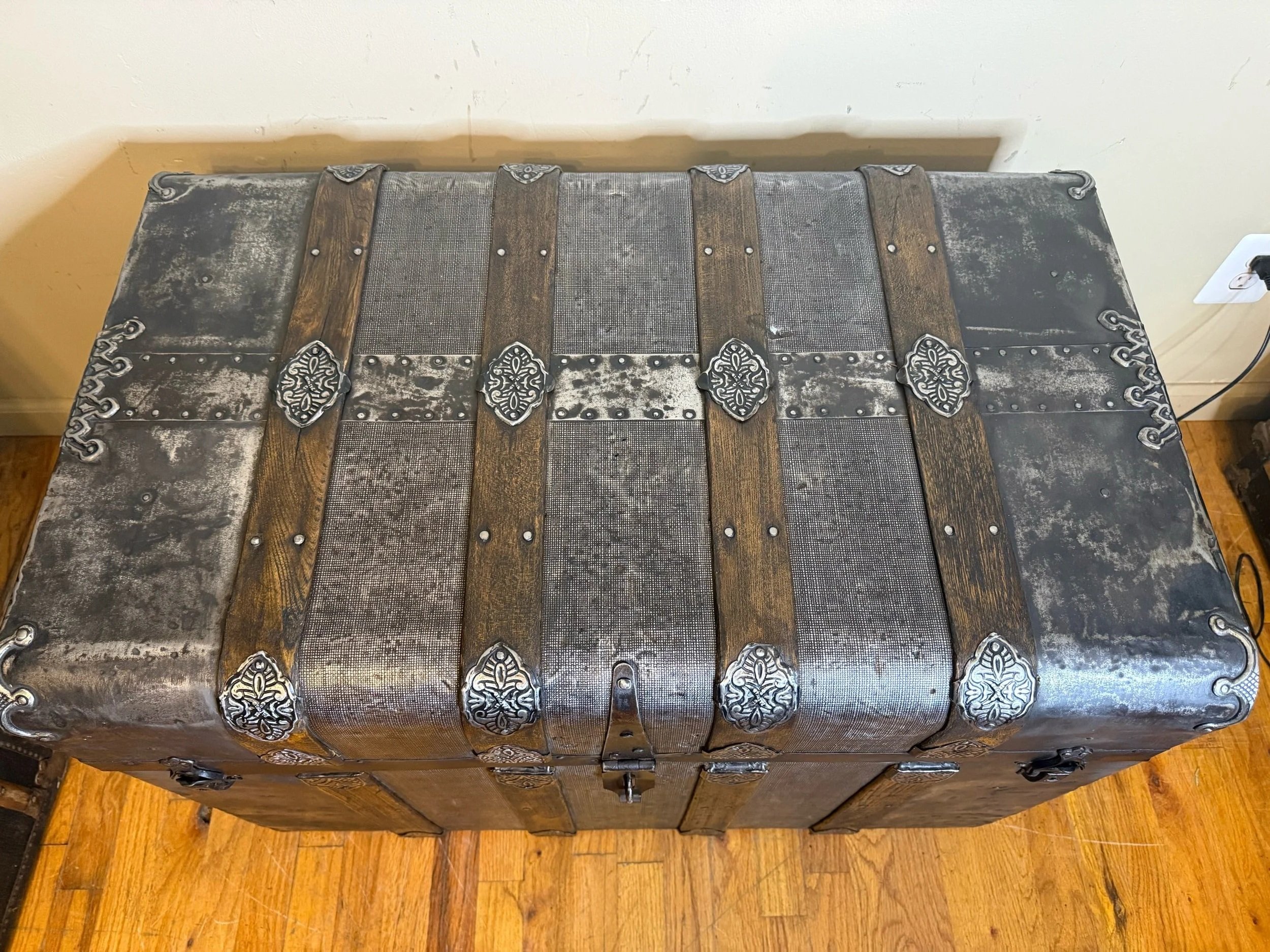 Refinished antique trunk coffee table with natural wood details