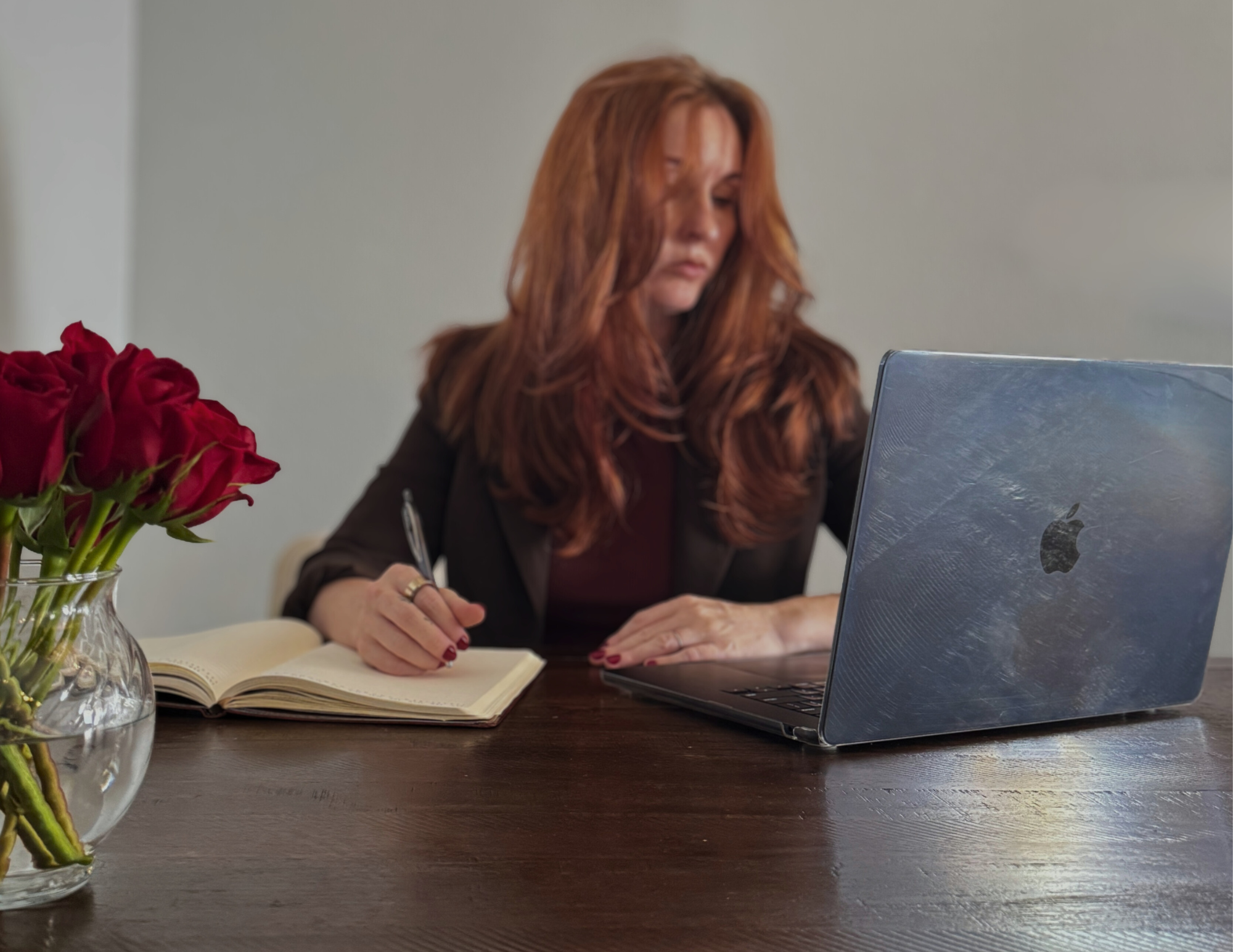 White Label Marketing and contract collaborations for embedded support sitting at a desk with red roses.