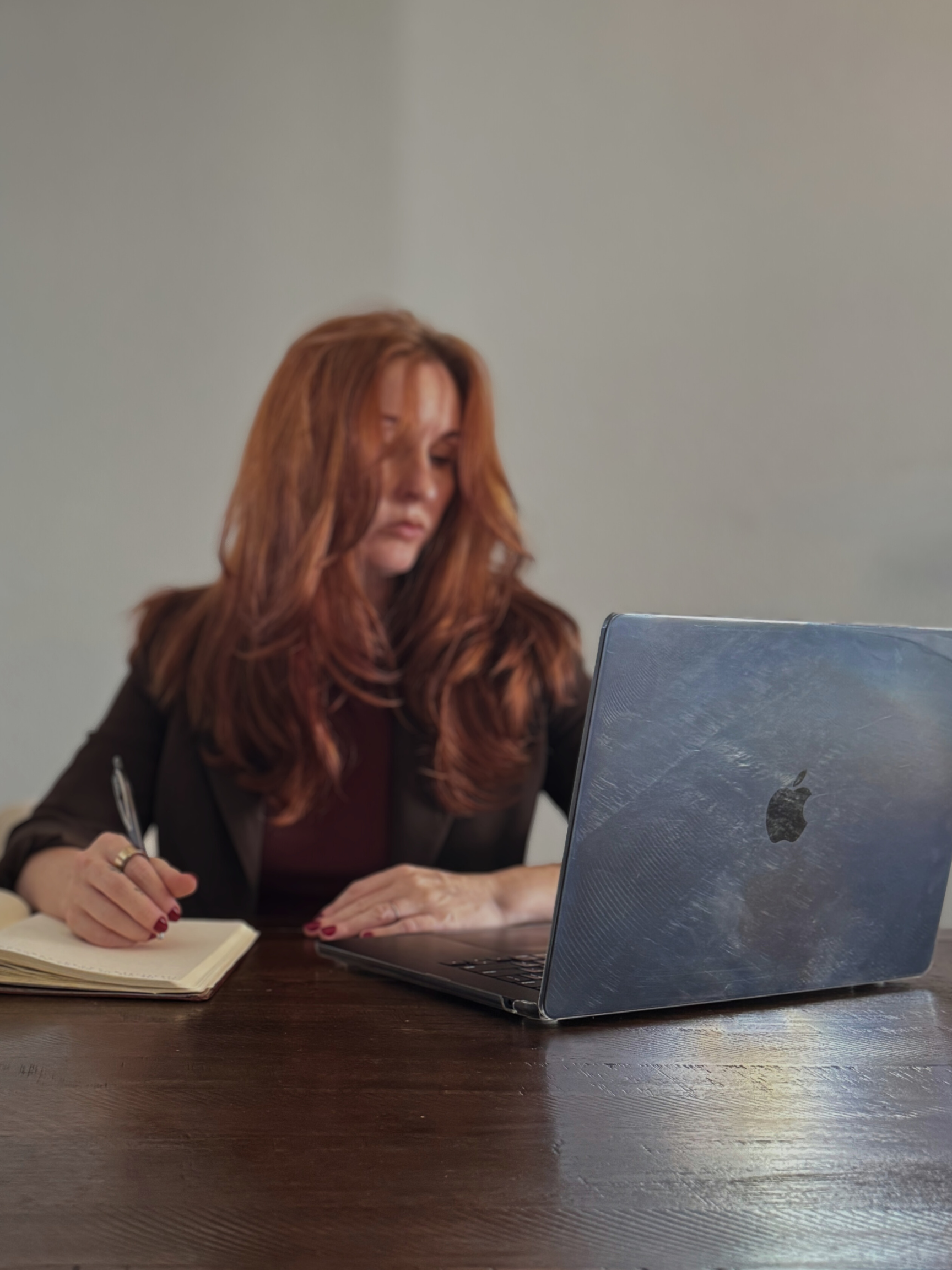 Contract Collaboration with white label marketing options available while sitting at a desk with a MacBook laptop