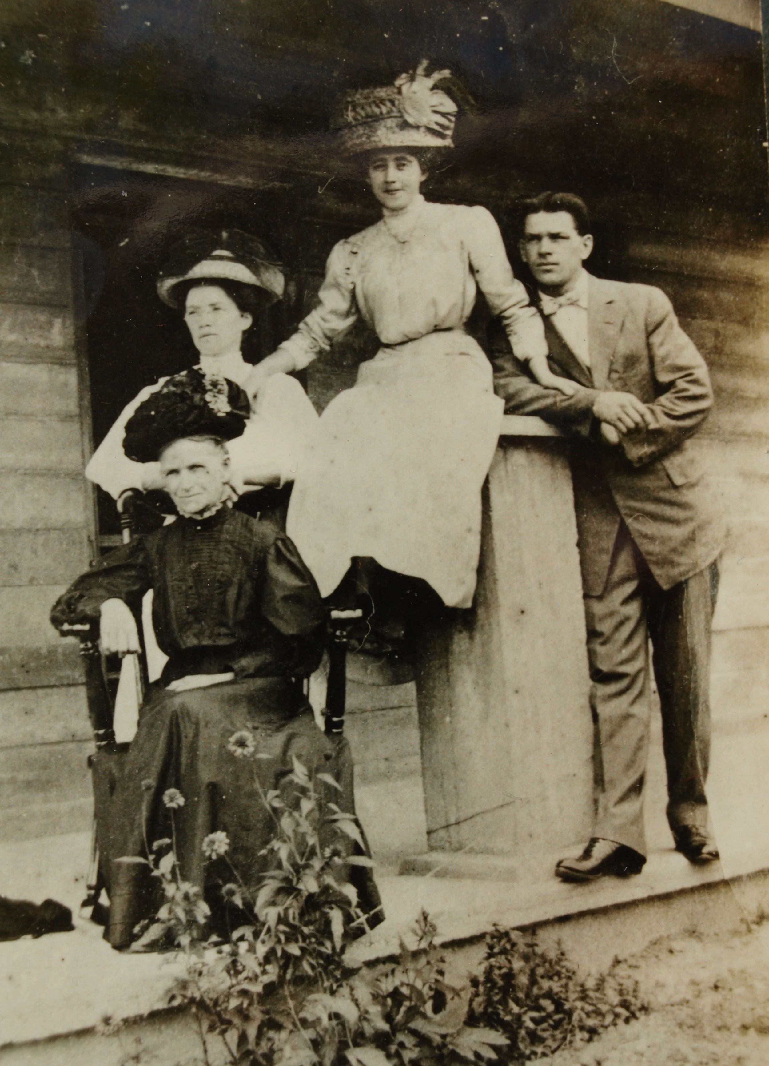 1914 photo of Martha Mitchell, seated, with Eva, her daughter, Andrew's sister, and on the post, Kizzie Mitchell, and beside her is her husband Loren, Andrew's brother. This is in Denver, CO. 