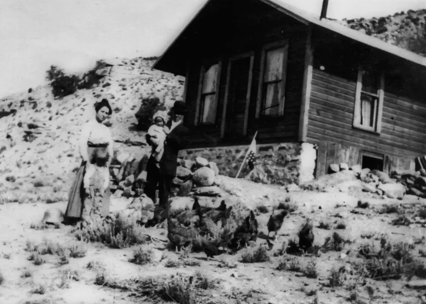 Andrew and Sadie with Bryant, Hubert and Helen in front of their mountain home, Rifle, CO, early 1900s. 