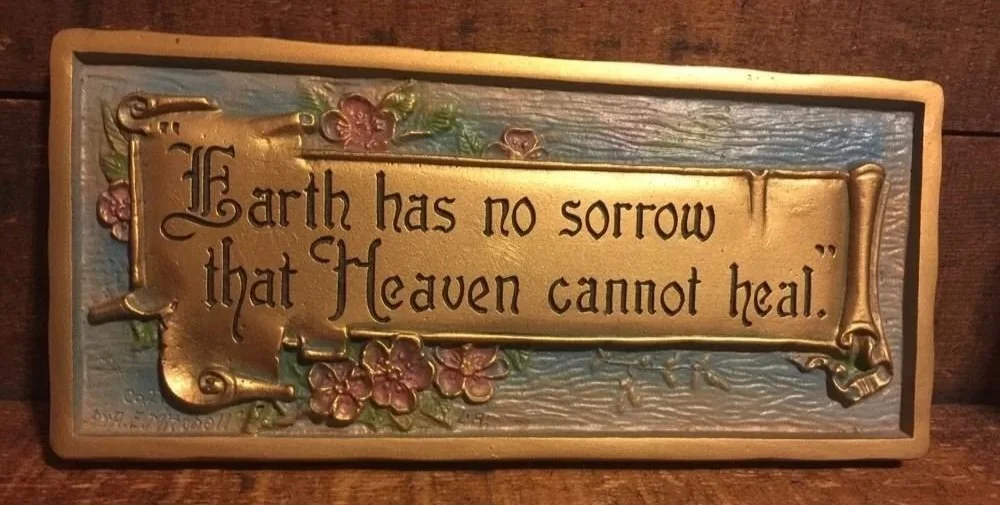 "Earth has no sorrow..." This plaque was used for the plaque "God Bless America" as well, written in the scroll area.