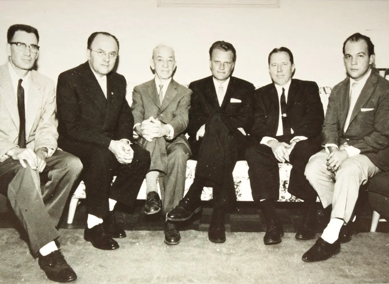 Billy Graham spoke at the Baptist World Convention in Brazil in 1960 and Hubert Mitchell (on Rev. Graham's left) played the piano. Andrew Mitchell, friend to Rev. Graham, is on his right. We have many letters the Billy Graham Library has provided dig