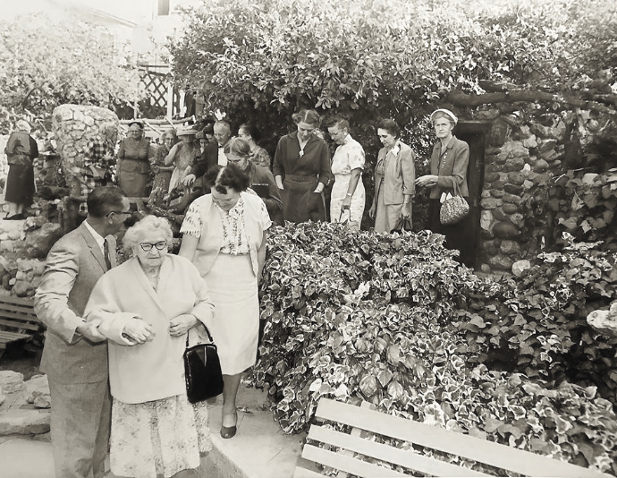 Go-Ye Fellowship service attendees leaving after a service. The Victory Vase is seen in the background. 