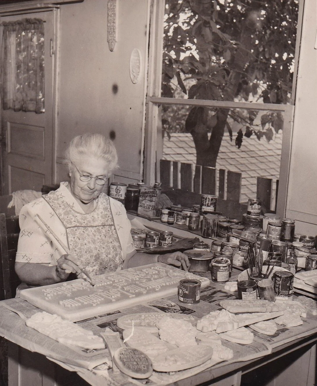 Jennie Mitchell's sister Nellie painting plaques in Brazil