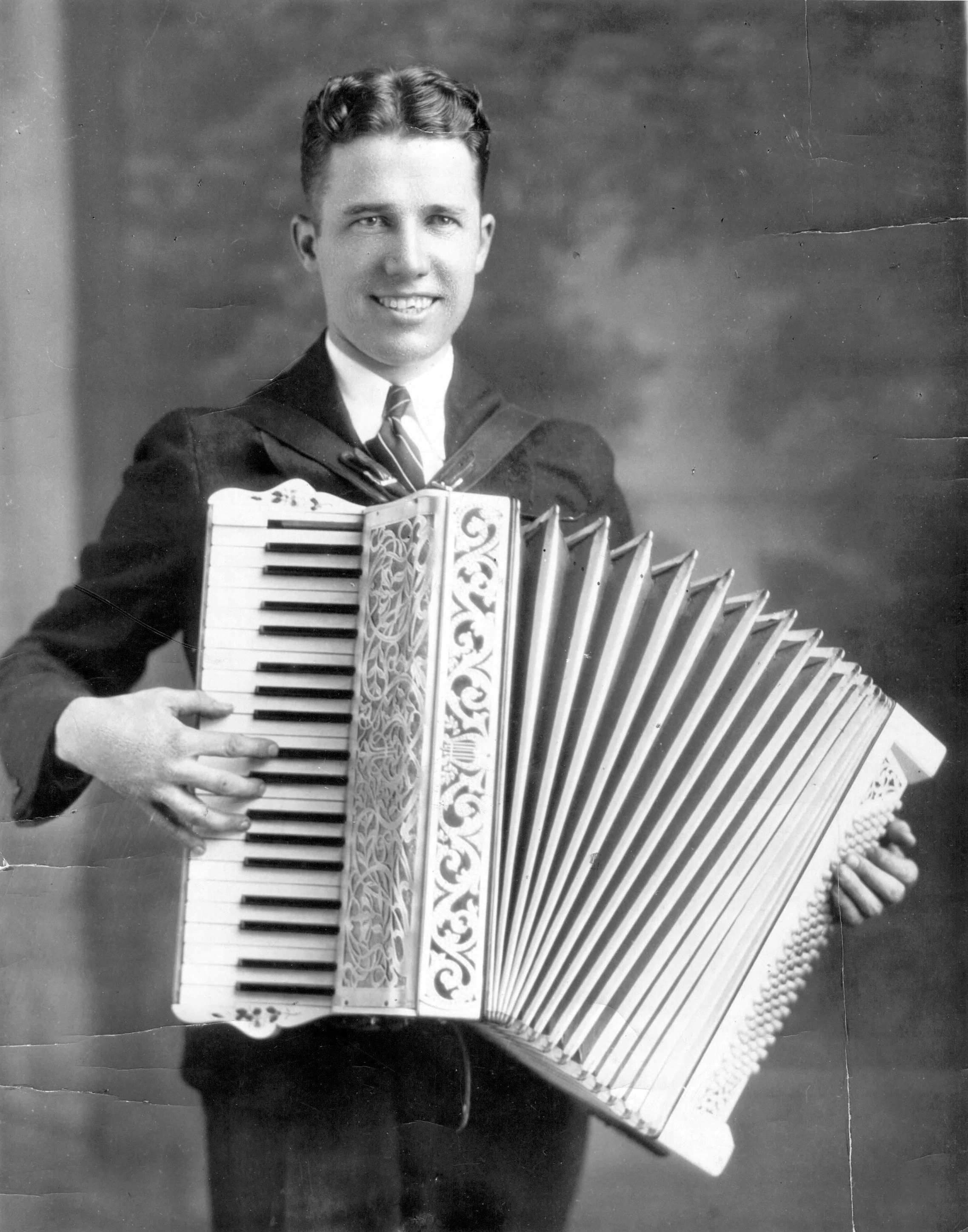 Son Hubert with his accordian. Hubert was an evangelist and missionary. He was  involved with Youth for Christ, played the piano for Billy Graham crusades, preached for Navigators conferences, started Christians in Govt. in Chicago and Los Angeles an