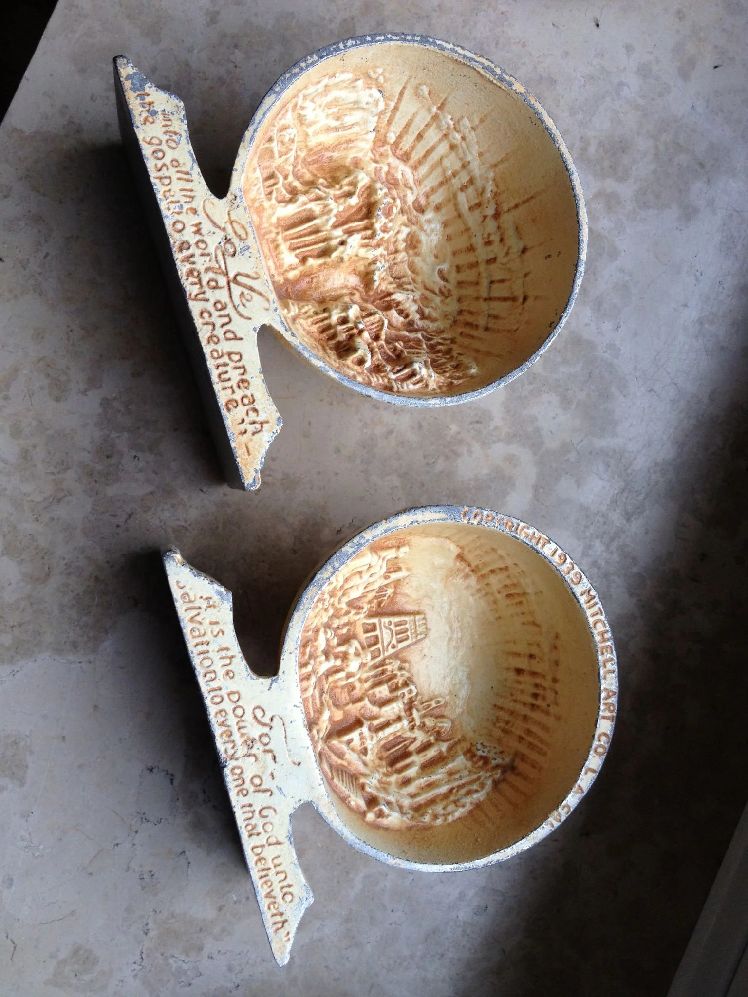 Inside of the globe bookends is a view of Heaven. The inside reads "Go ye into all the world and preach the Gospel to every creature. It is the power of God unto salvation to everyone that believeth. " copyright 1939