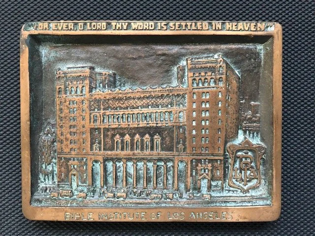 Small "Forever O Lord" plaque of the Biola and Church of the Open Door building downtown Los Angeles. This plaque was sold in the Biola bookstore as early as the teens.
