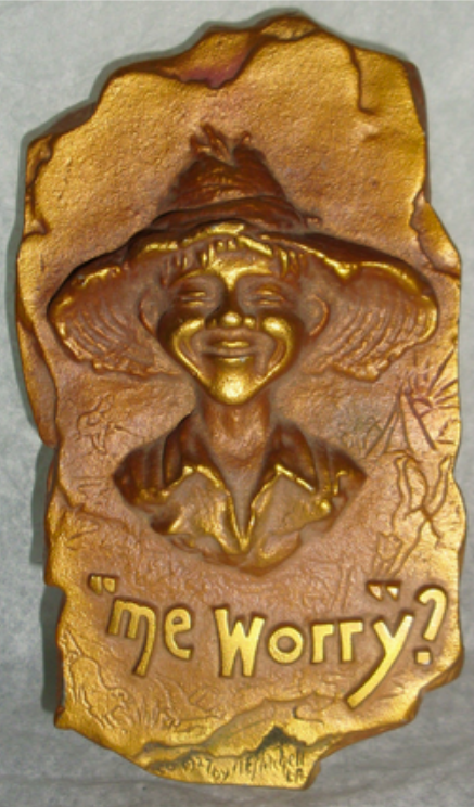 "Me Worry?" - This design has been called the precursor to the "Mad" magazine character and was most likely created around the turn of the century in Colorado. There are carvings of boys enjoying the outdoors around the bottom, and at the time Andrew