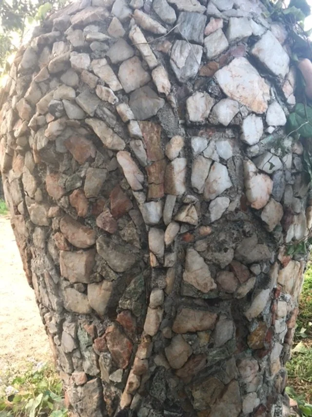 One of the two lily patterns on the side of the vase. 