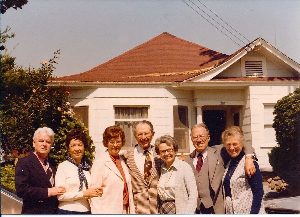 Kaare Wilhelmsen, Jean Mitchell Wilhelmsen, Lucille Mitchell, Bryant Mitchell, Helen Mitchell Morken, Hubert Mitchell, and his wife Rachel Mitchell. They are in front of their childhood home on Waterloo St., Los Angeles. This is the large Mitchell co