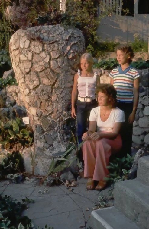 A.E. Mitchell great-granddaughters Lolisa Warner Collins, Avonna Warner Schirman standing, and Lori Warner, seated, with the vase in 1974.