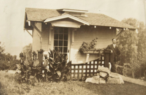 Andrew in front of his art studio behind the family home in 1915. This building is still on the property.