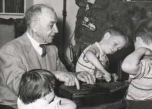 Andrew playing the autoharp with grandchildren