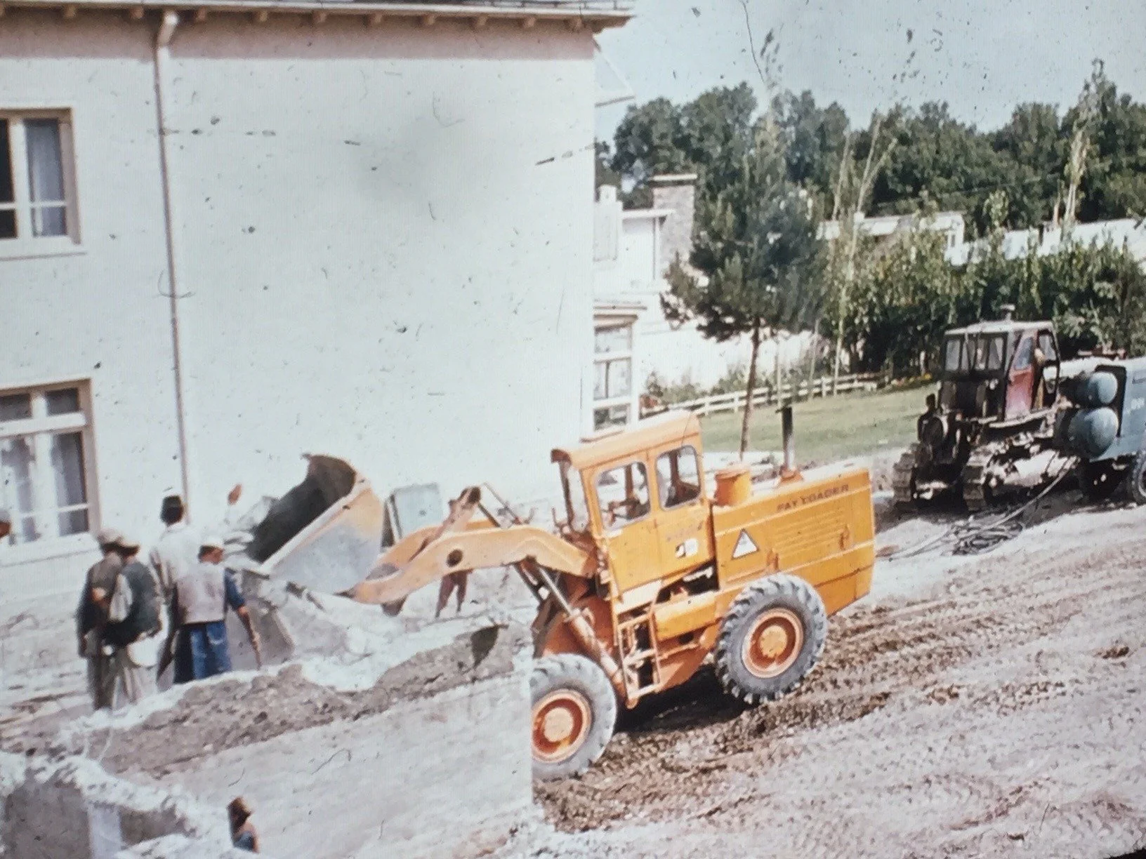 Church in Afghanistan - workers destroying the church by order of the government. the story goes, that the ladies were passing out refreshments to the workers. (Jean Mitchell Wilhelmsen and Helen Mitchell Morken)