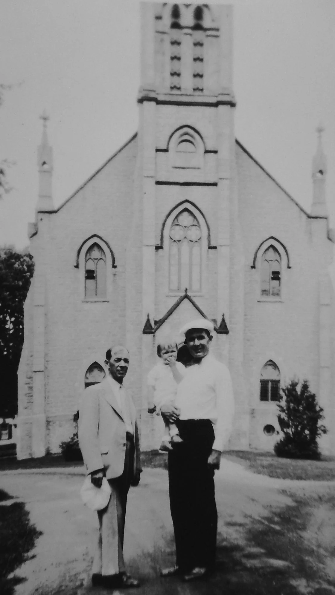 In the early 1930s Andrew and son Bryant and his daughter visited Elora, Canada, the Mitchell hometown. Here they are in front of the church the Mitchells attended, Knox Presbyterian. 