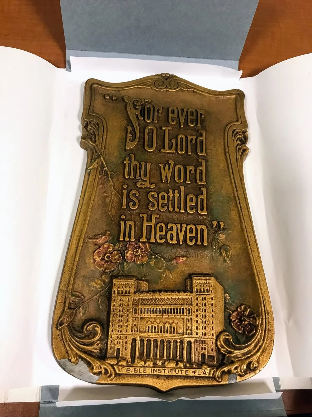 This is an A.E. Mitchell plaque Biola has in their archives, packed beautifully by the Library Archives team. This could have been made between 1915-1922.