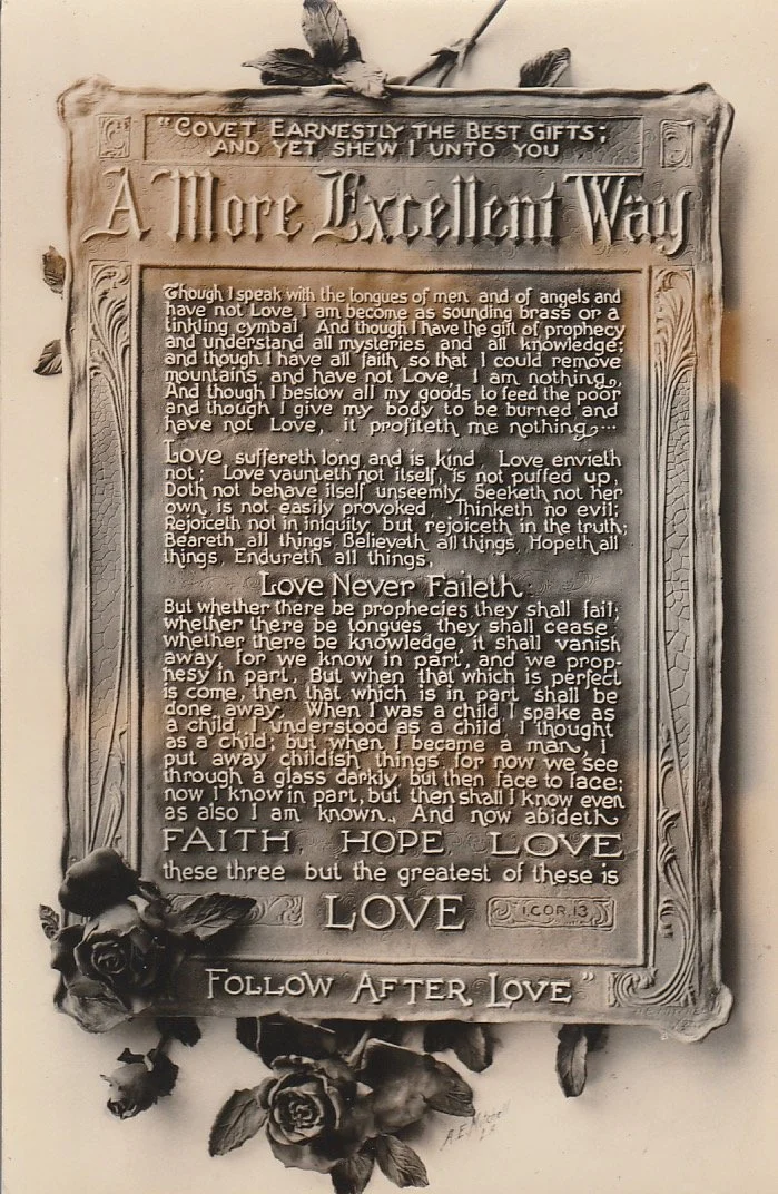 The only known photo of a plaque in the clay stage. To make the lettering readable he may have painted white lettering on a photo and photographed it again. 