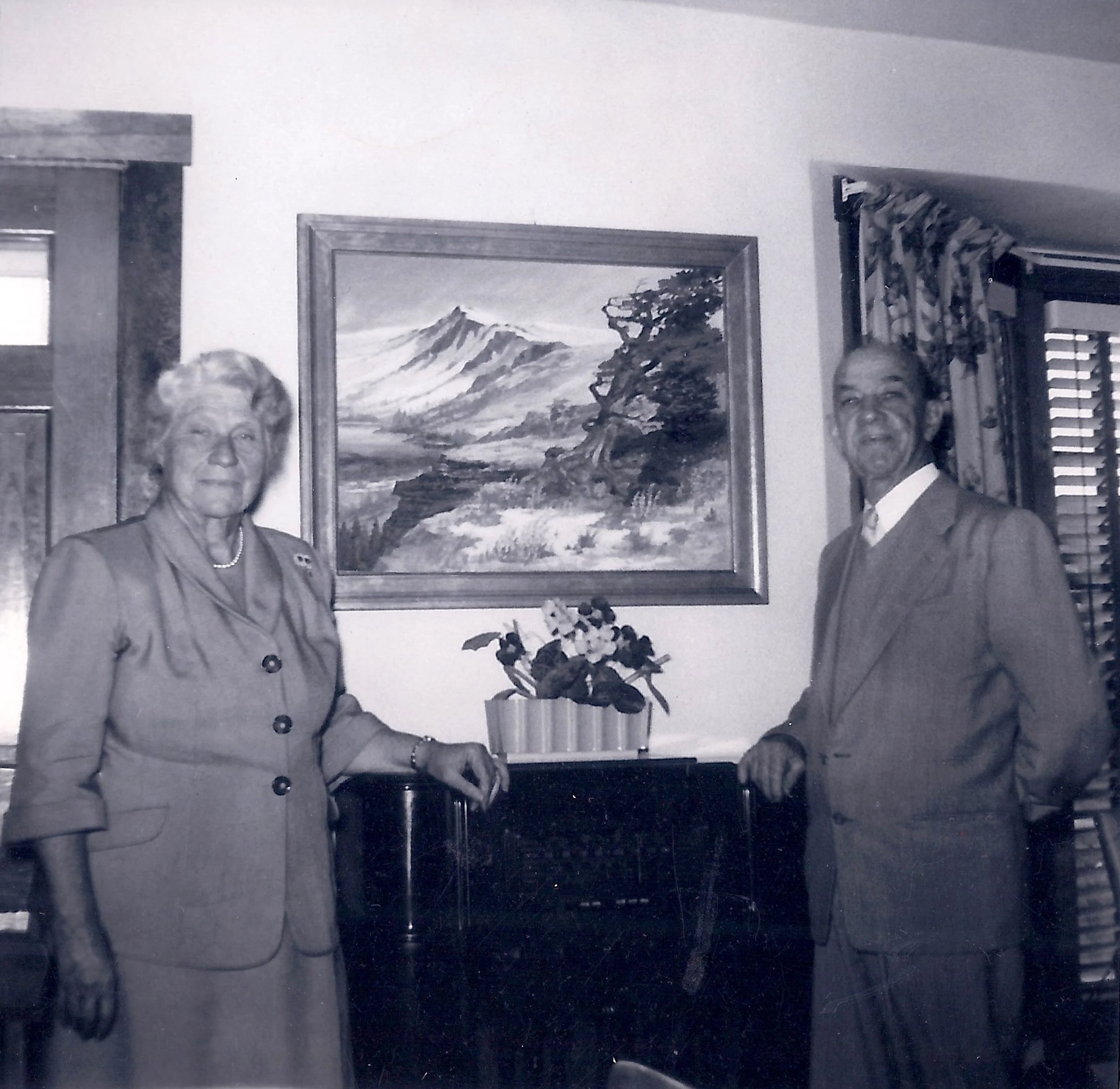Andrew and Jennie at home with one of Andrew's paintings. 