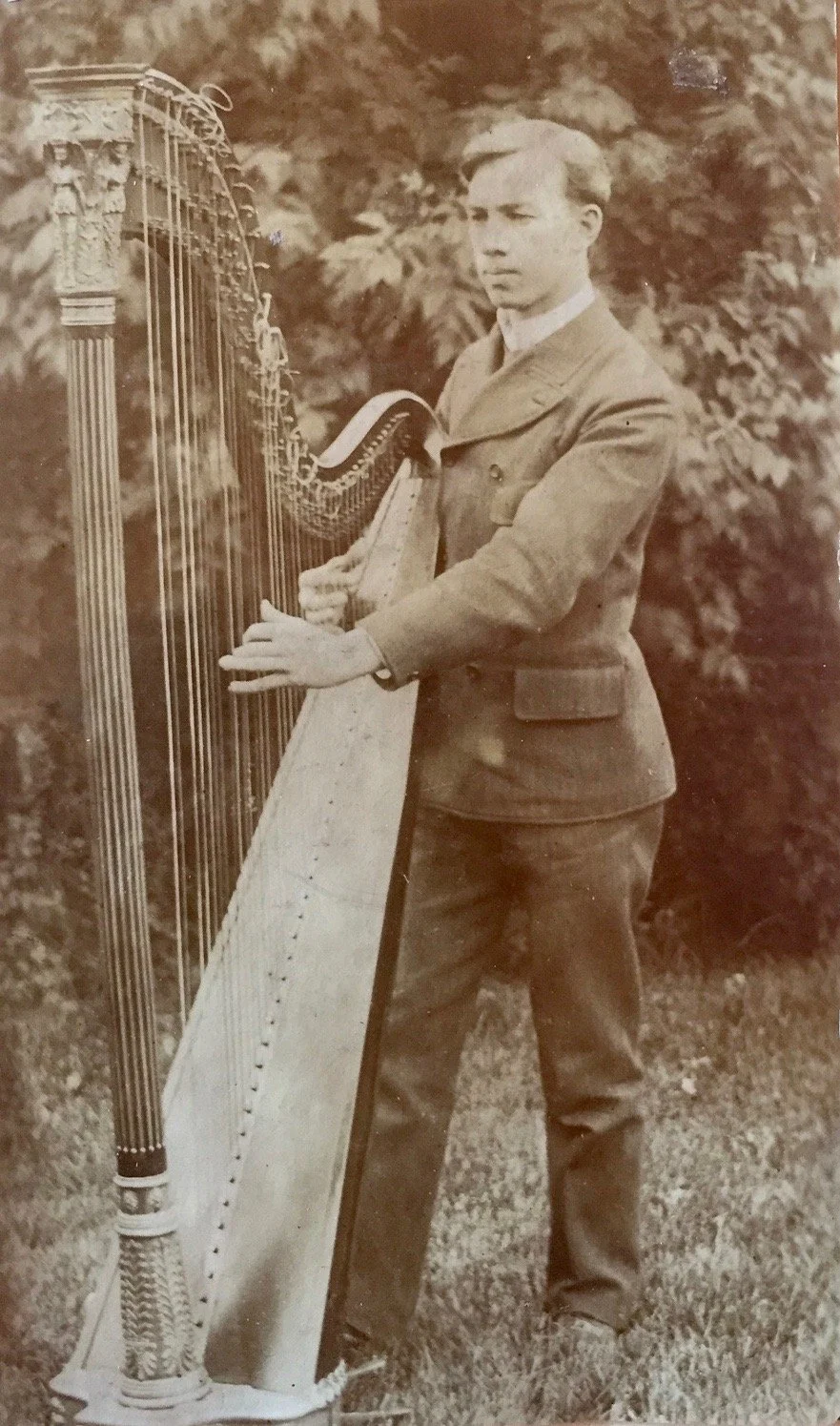 Andrew with his large harp in Denver