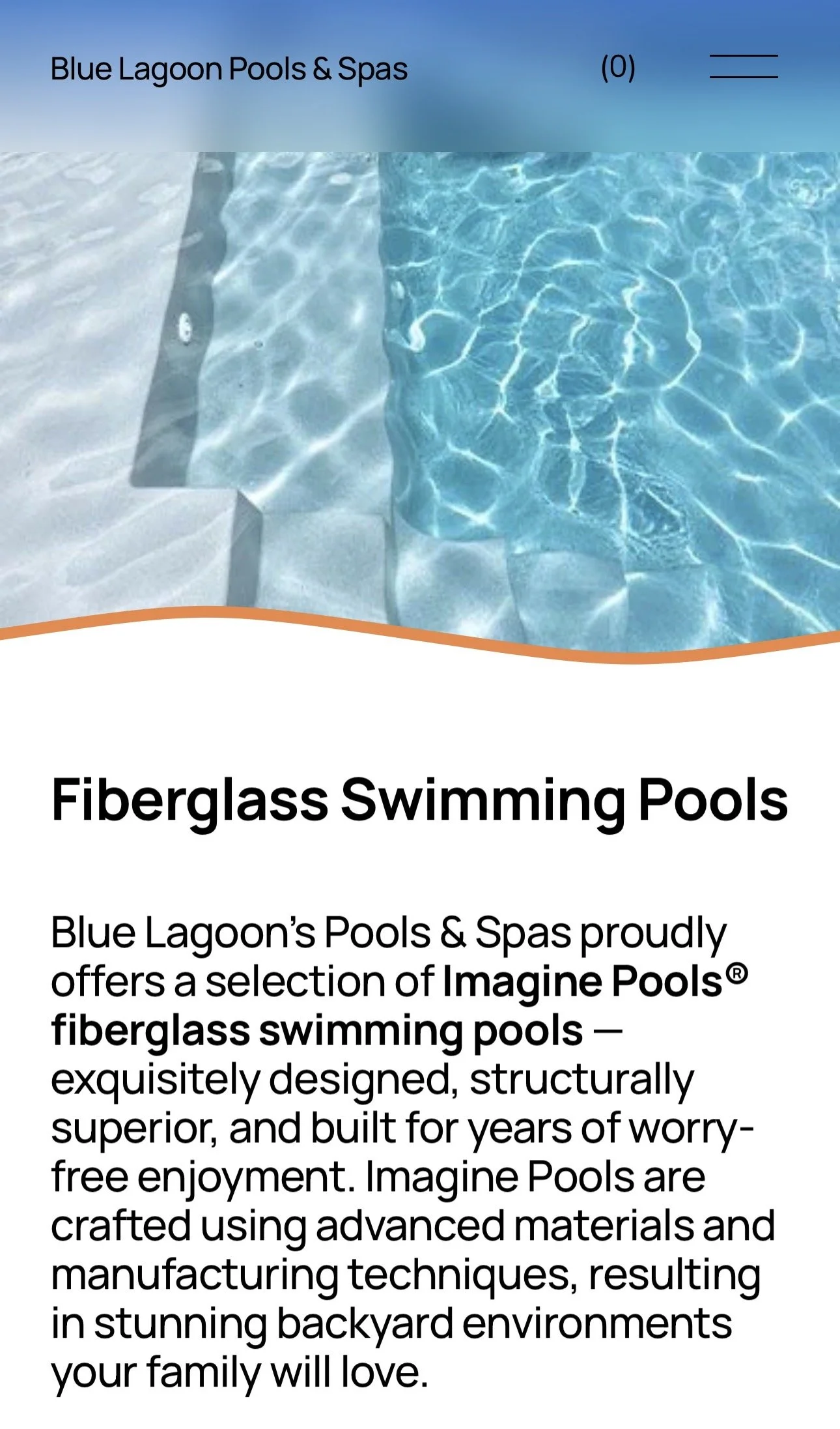 Close-up of a fiberglass swimming pool with clear blue water and white steps.