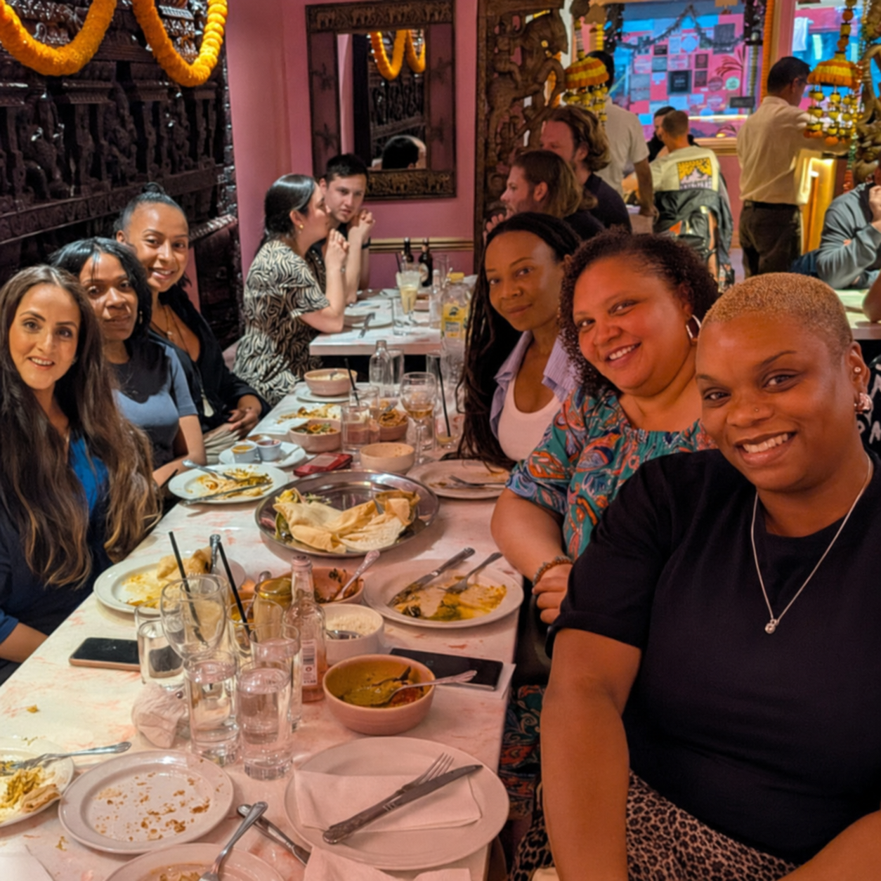 Women share a meal and conversation during an Islington Healing Network community outing.