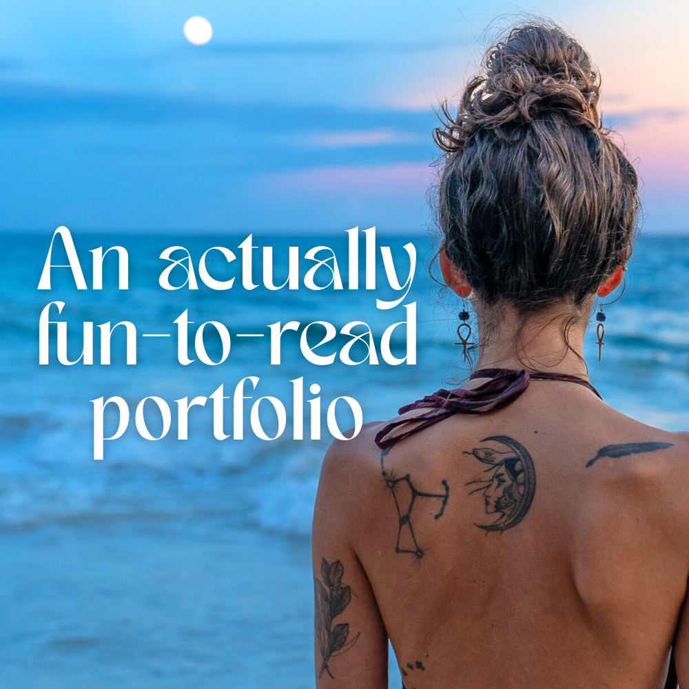 A woman with tattoos and earrings looking at the ocean during sunset.