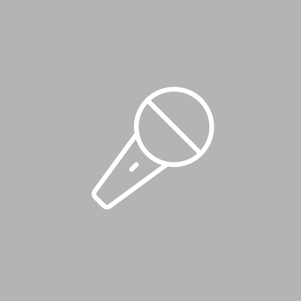 A microphone icon on a gray background.