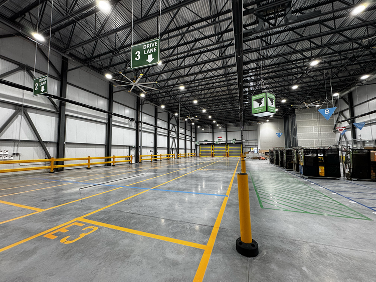 Warehouse interior with the floor marked out under the roof structure.