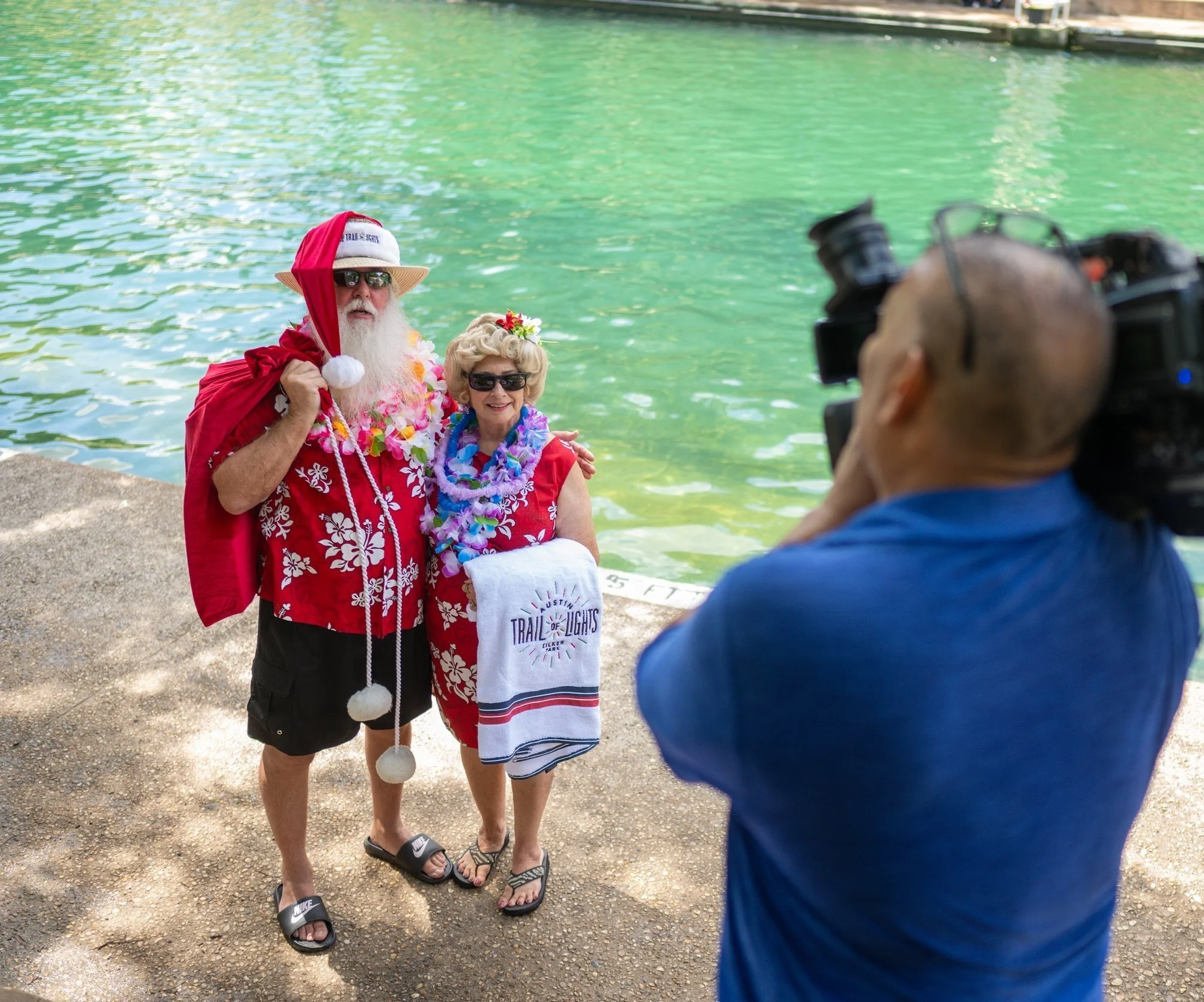 Santa visits Say My Name client Austin Trail of Lights at Barton Springs pool