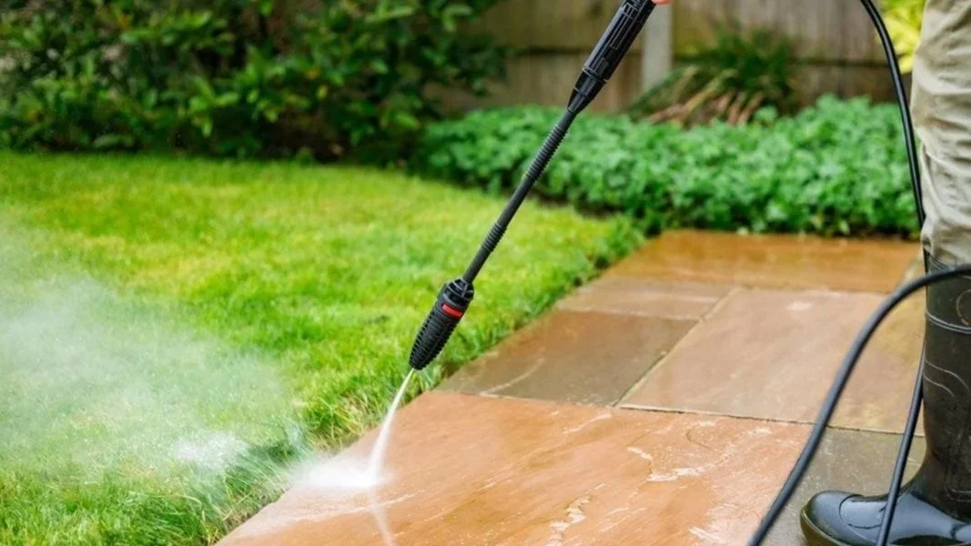 Professional power washing on a concrete driveway in Boise, Idaho