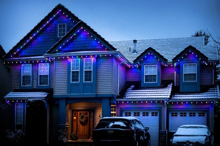 Custom-fit C9 holiday lights on a residential roofline in Meridian.