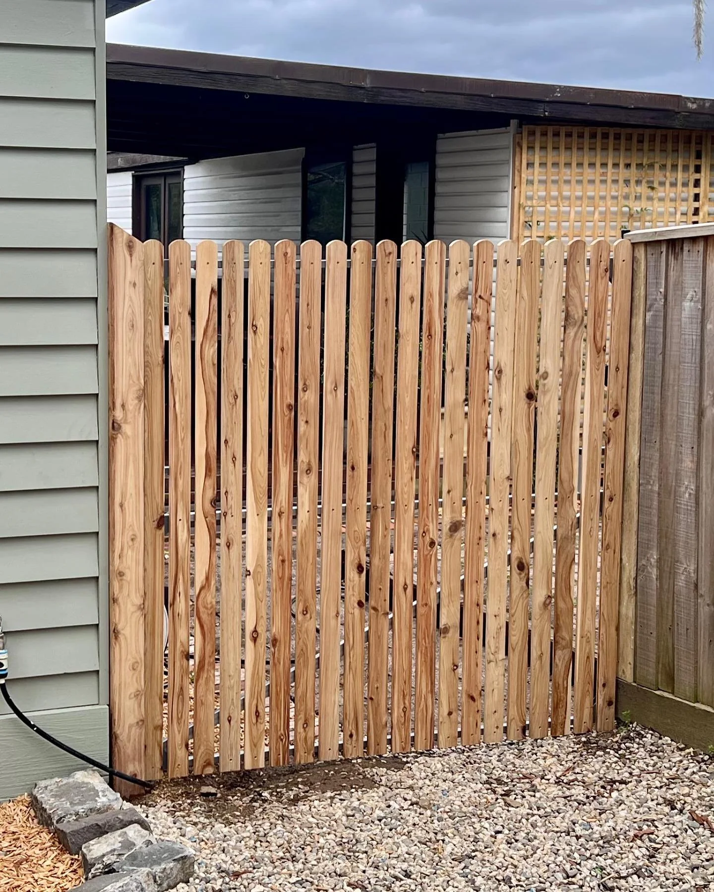 How about this? "Looking for a unique and charming gate design? Check out our custom gate featuring cypress half-round pickets! It's a beautiful and functional addition to any home or property. Take a closer look and let us know what you think!&
